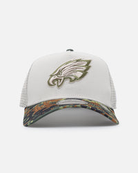 New Era Philadelphia Eagles "Camo Visor" 9FORTY A-Frame Trucker Snapback Stone/Olive