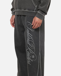 Mitchell & Ness Las Vegas Raiders Star Script Relaxed Track Pants Washed Black